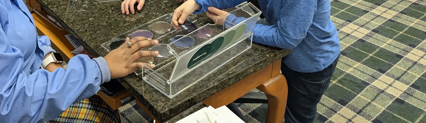 Demonstration lenses laid out on the counter during a frame and lens conversation.